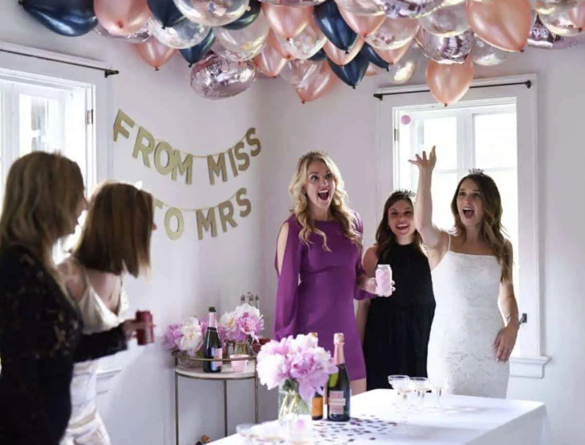 women playing prosecco pong