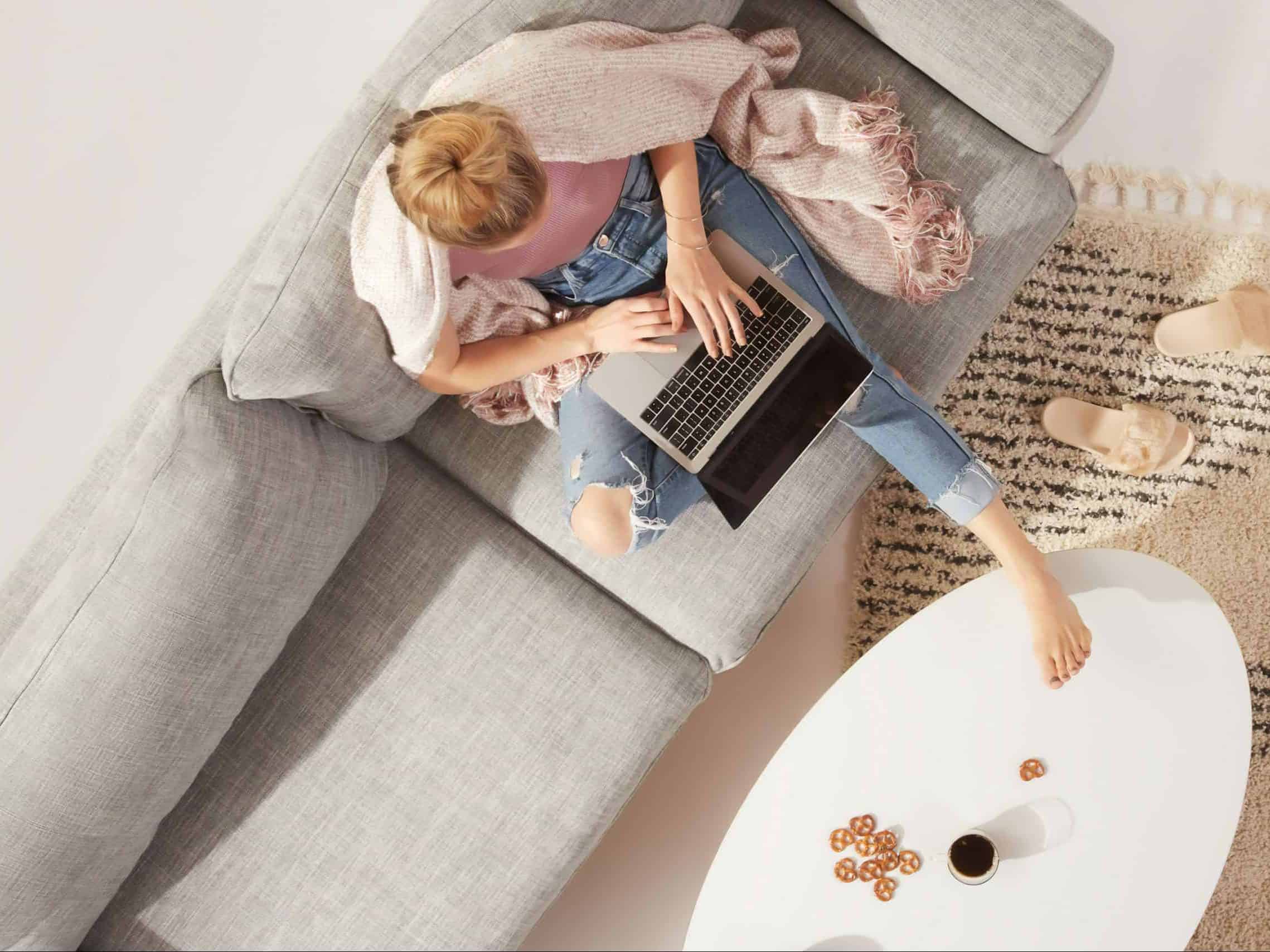 woman typing on her laptop