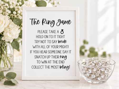 One Ring Game sign beside a small bowl of plastic rings