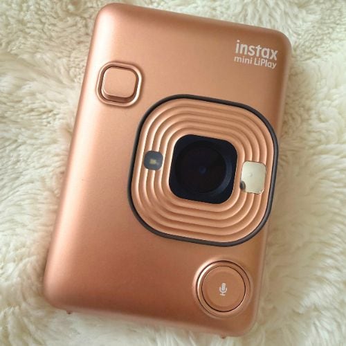 Instant camera for taking and printing photos on the spot