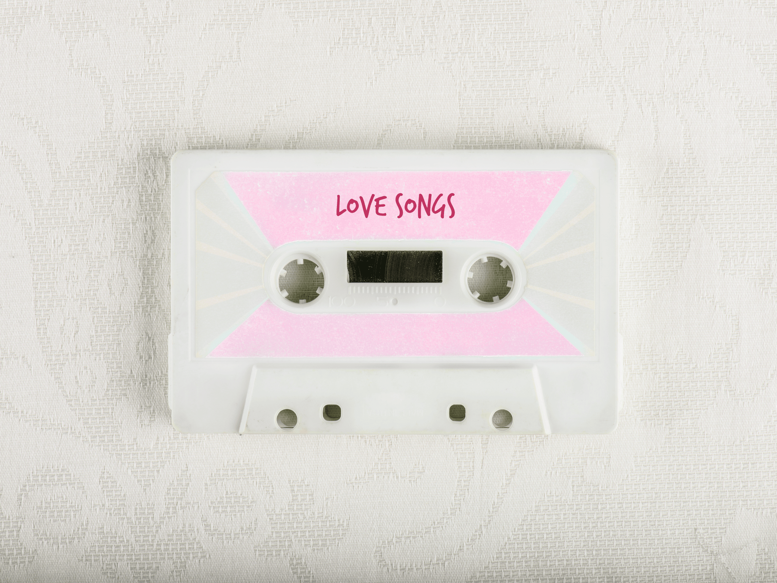 Image of a cassette tape with Love Songs, representative of the Name that Love Song Bridal Shower Game
