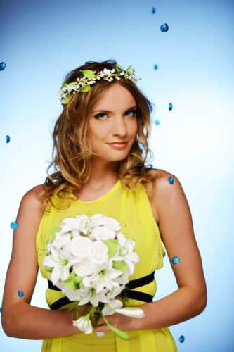 Girl in a yellow dress with flowers in her hair