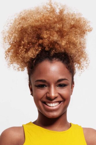 Black Woman with curly top hair style