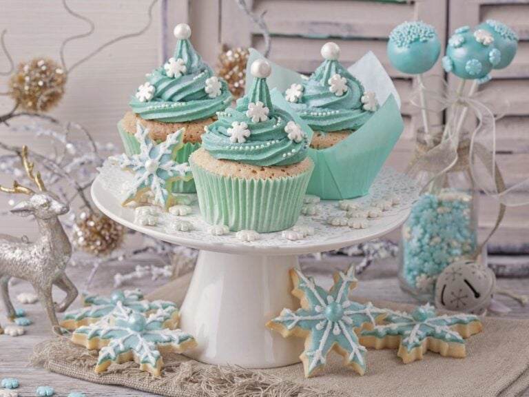 Plate with Snowflake topped cupcakes as part of a selection of Winter Bridal Shower Desserts