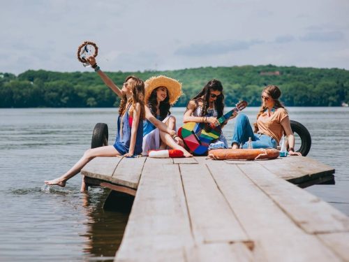 group of women celebrating a lake bachelorette party